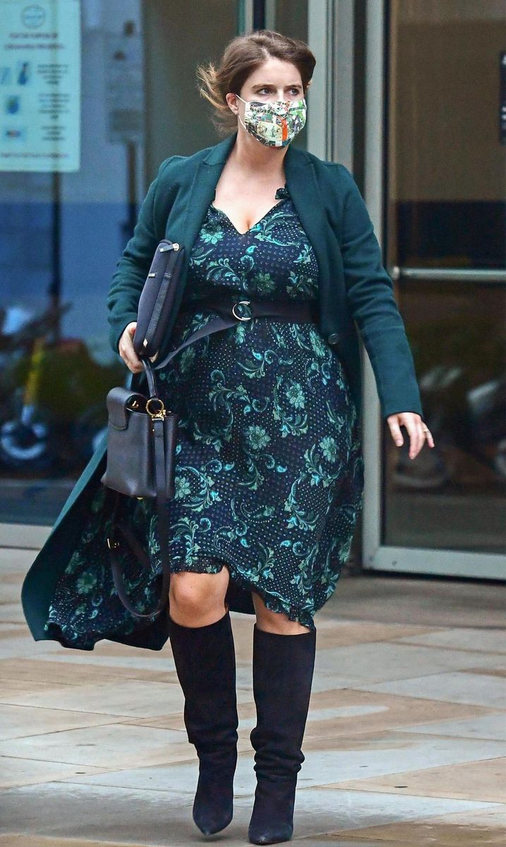 Princess Eugenie seen showcasing her growing baby bump in the capital as she battles with the windy conditions. The Princess was seen looking elegant and fashionable as she stepped out in a matching green dress and coat in Mayfair London.