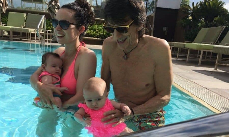 Family fun in the sun! Ronnie Wood and his wife Sally took their four-month-old daughters Gracie Jane and Alice Rose for a dip in the pool. The "water babies" were seen wearing pink suits while their parents held on to them in the water.
Photo: Instagram/@ronniewood
