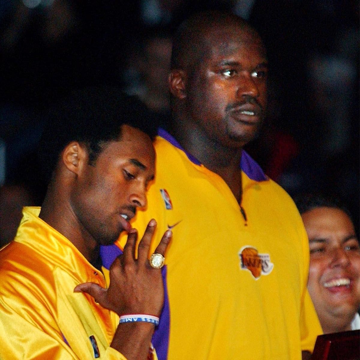 Kobe Bryant (L) of the Los Angeles Lakers tries on