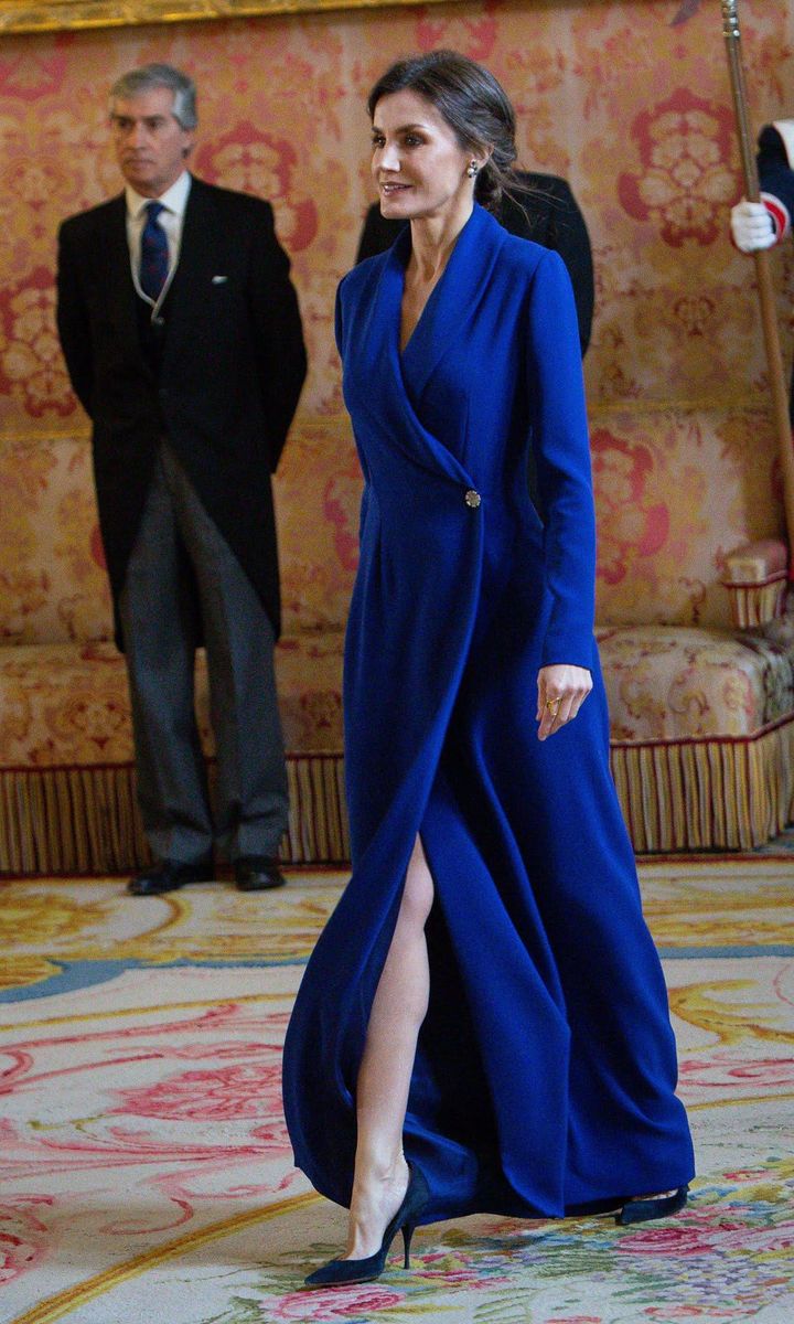 Queen Letizia of Spain wearing a blue dress at the royal palace in Madrid