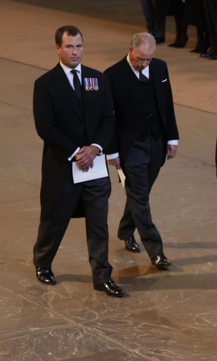 Queen Elizabeth's eldest grandchild, Peter Phillips, who walked in the procession to Westminster Hall, next to Her Majesty's nephew David Armstrong-Jones