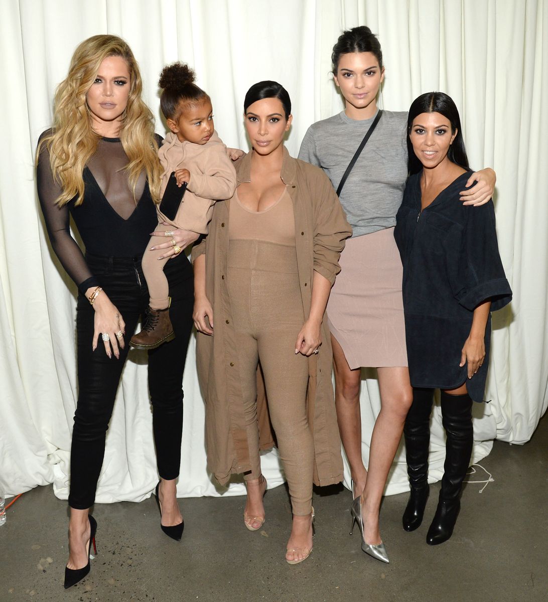 Khloe Kardashian, North West, Kim Kardashian West, Kendall Jenner and Kourtney Kardashian attend Kanye West Yeezy Season 2 in 2015.