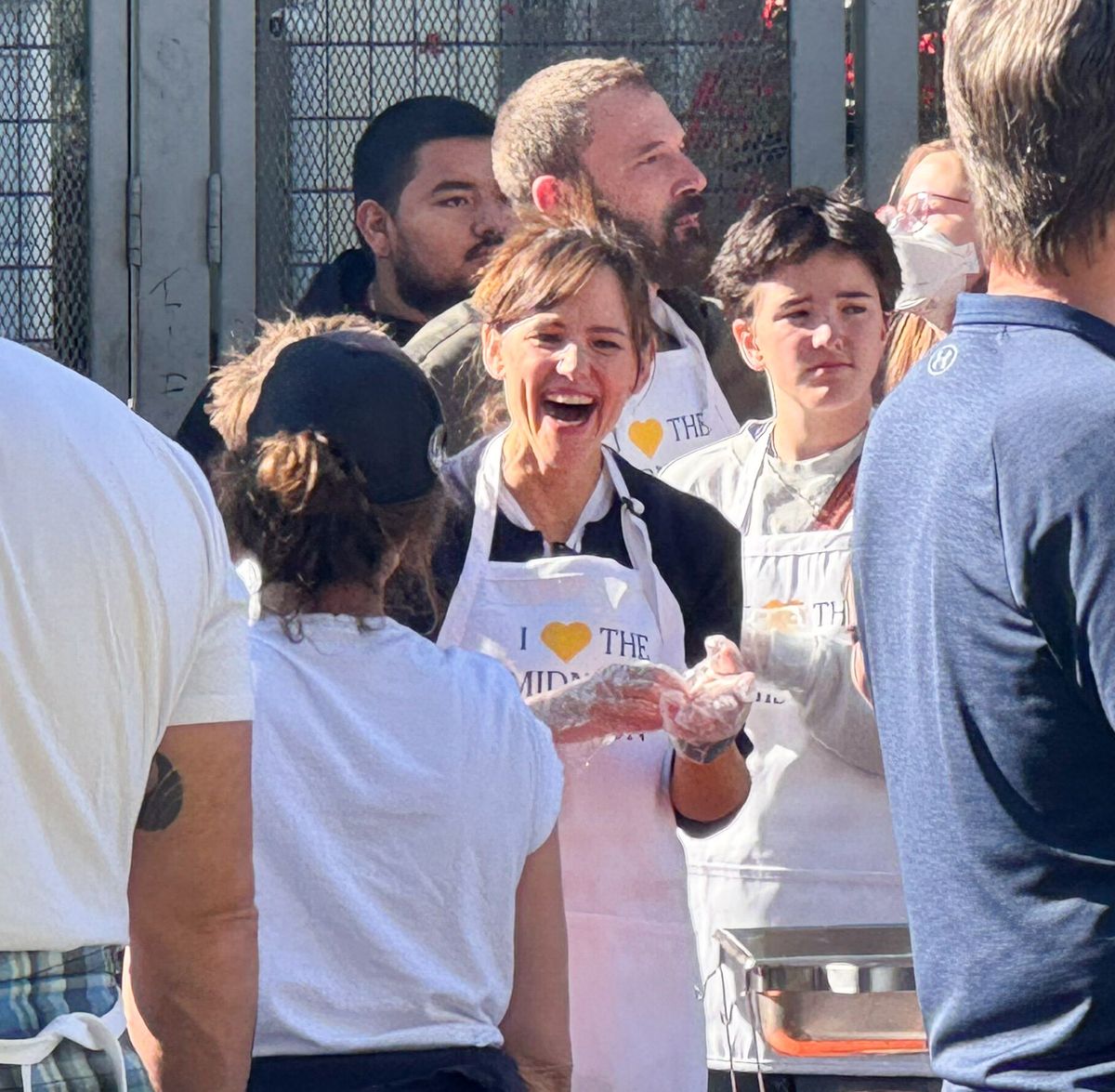 Ben Affleck and Jennifer Garner with their kids feeding homeless people in downtown Los Angeles.