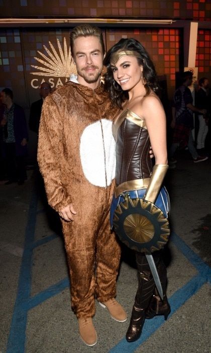 The dancing couple! Derek Hough looked cuddly alongside his girlfriend and fellow dancer Hayley Erbert at the Casamigos Halloween event. The 32-year-old dancer wore a comfortable-looking bear onesie while Hayley had a much more intricate costume. She looked fierce as Wonder Woman, shield and all!
Photo: Getty Images