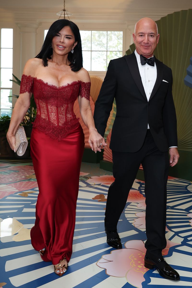 Jeff Bezos and his fiancee Lauren Sanchez arrive at the White House for a state dinner 