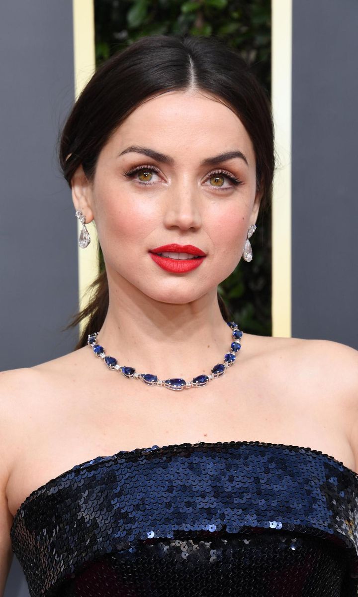 Ana de Armas with tied back hair and red lips