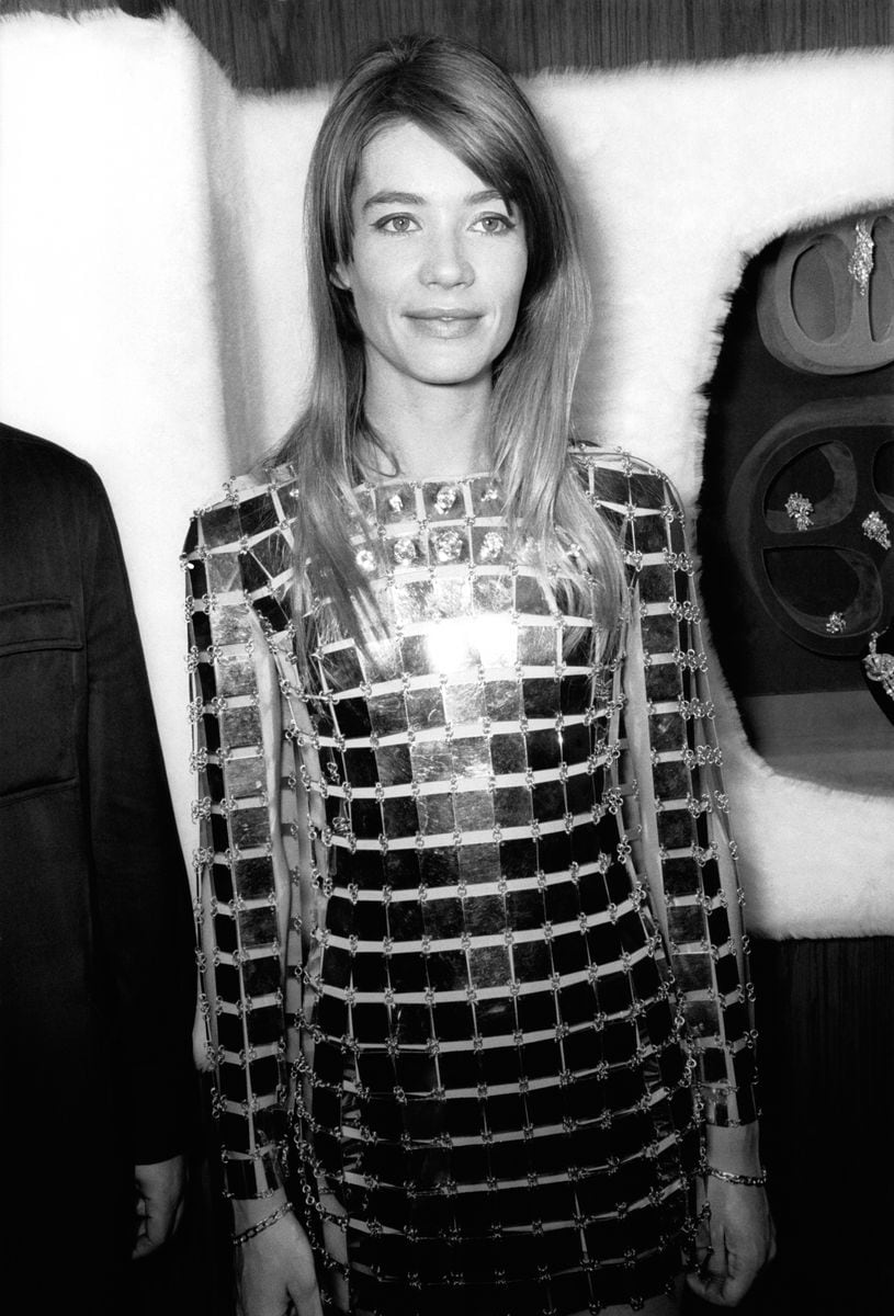 Françoise Hardy wearing the most expensive dress in the world in 1968. The dress featured 1,000 gold plaques, 300 carats of diamonds, and weighed 20 pounds.