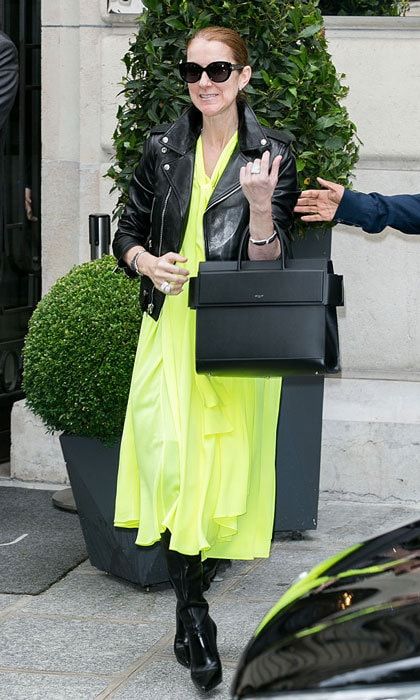 Celine added pop of color to her Balenciaga ensemble by wearing a neon yellow tent dress beneath her biker leather jacket.
<br>
Photo: Marc Piasecki/GC Images