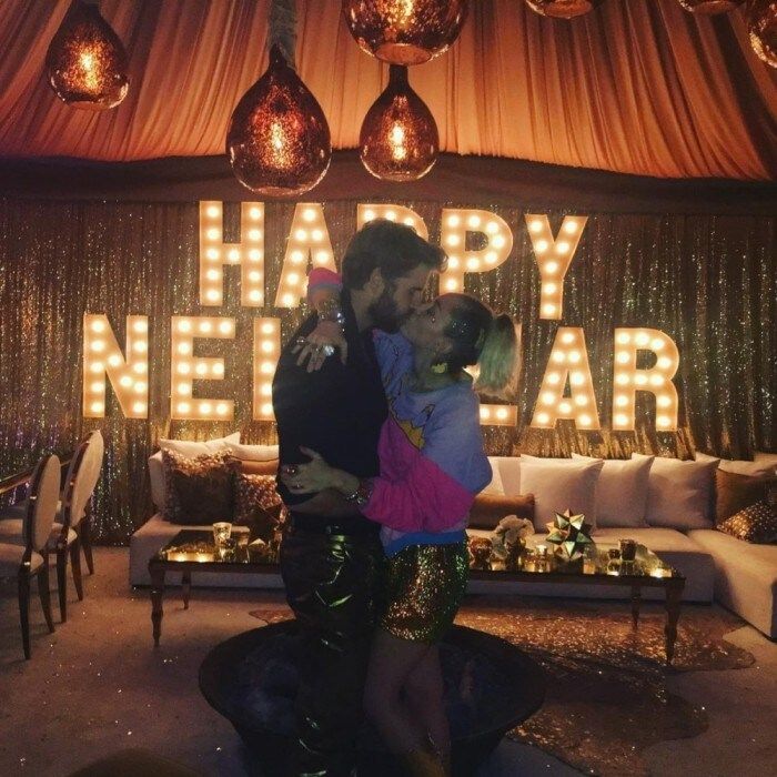 New Year's kiss! Miley Cyrus and Liam Hemsworth locked lips at what appeared to be a mixed family New Year's Eve party. Members of both the Cyrus and Hemsworth clan seemed to be in attendance.
Miley was happy to share her NYE kiss with fans on Instagram. There was no caption, but is one really needed?
Photo: Instagram/@mileycyrus