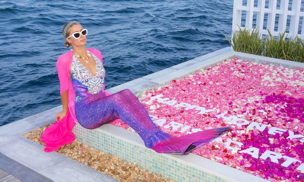 Paris Hilton becomes a mermaid and goes underwater to surprise husband Carter Reum