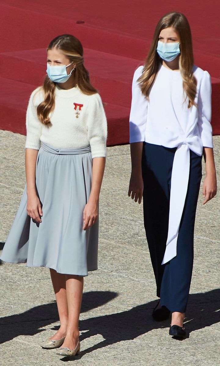 The sisters kicked off their busy week celebrating Spain's National Day on Oct. 12 alongside their parents. Leonor wore a flared skirt and & Other Stories puff sleeve $34 sweater. Sofia, on the other hand, opted for navy trousers, which she teamed with white Zara blouse that featured a statement bow.