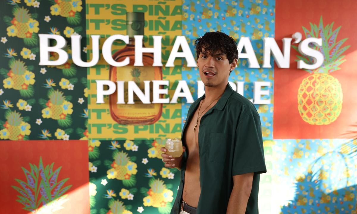 Omar Apollo wearing Kids of Immigrants Casa Piña Collection during Buchanan’s Pineapple Summer Kickoff Party in Miami