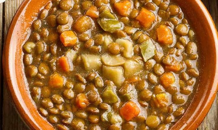 Bowl of lentil soup with carrots and potatoes