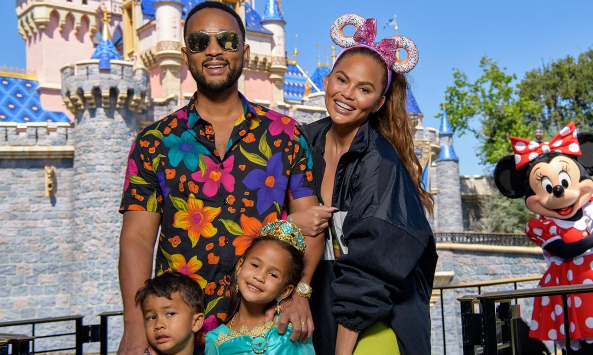 Chrissy Teigen And John Legend Visit Disneyland Resort in Anaheim, California