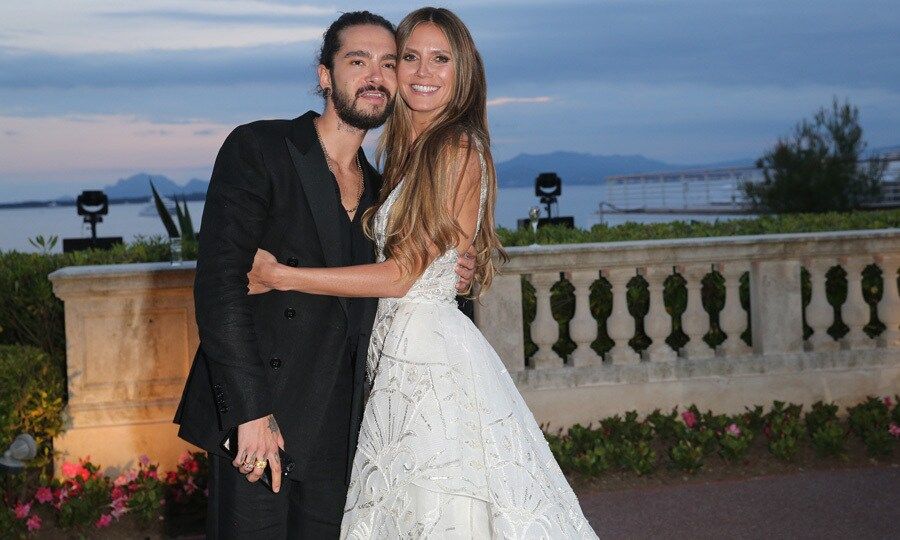 Heidi Klum and boyfriend Tom Kaulitz had one perfect setting for their red carpet debut. The couple shared kisses as they walked into the amfAR Gala during Cannes.
Photo: Getty Images