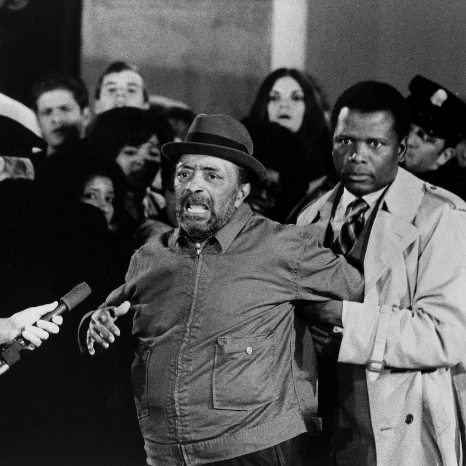 Sidney Poitier escorts Juano Hernandez in a scene for the United Artist movie "They Call Me Mister Tibbs!"