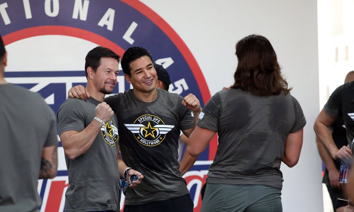 Mark Wahlberg leads a fitness class and coaches Mario Lopez