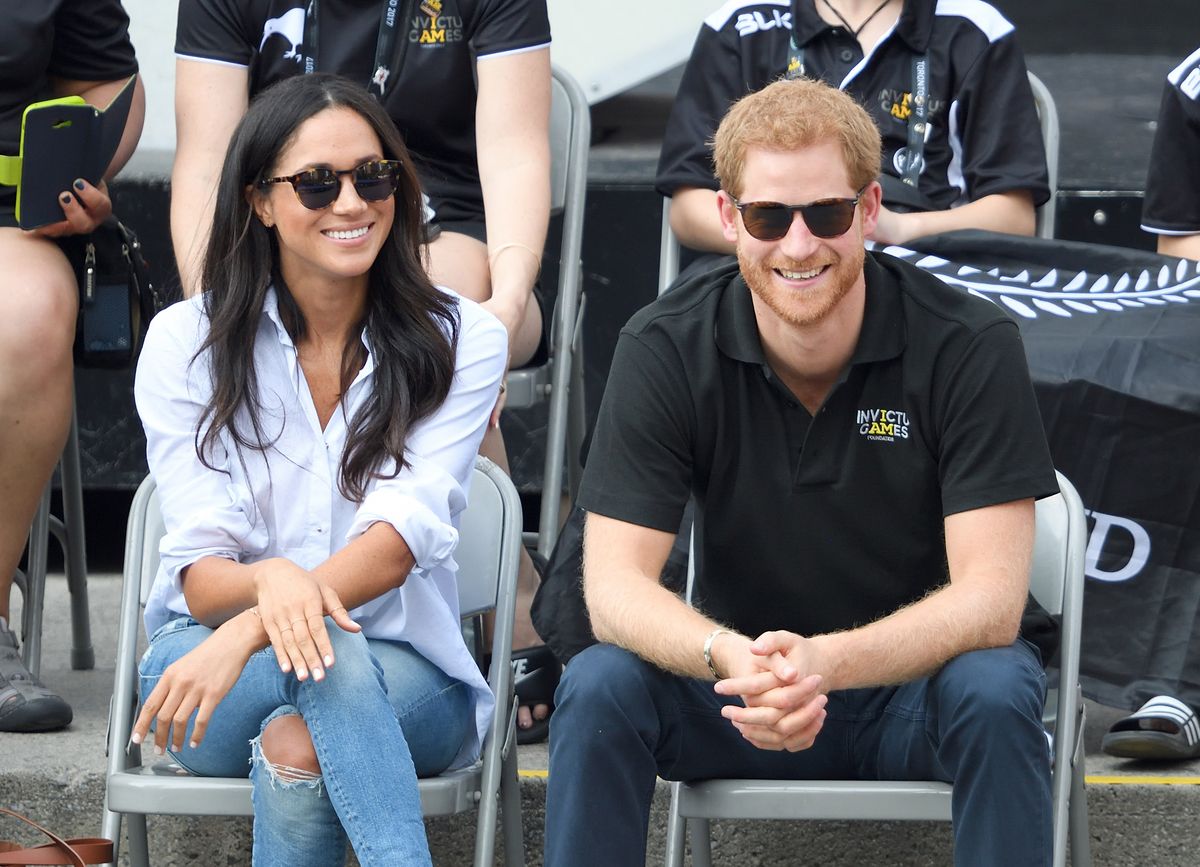   Meghan Markle and Prince Harry attend the Wheelchair Tennis on day 3 of the Invictus Games Toronto 2017 at Nathan Philips Square on September 25, 2017 in Toronto, Canada.  The Games use the power of sport to inspire recovery, support rehabilitation and generate a wider understanding and respect for the Armed Forces.  (Photo by Karwai Tang/WireImage)