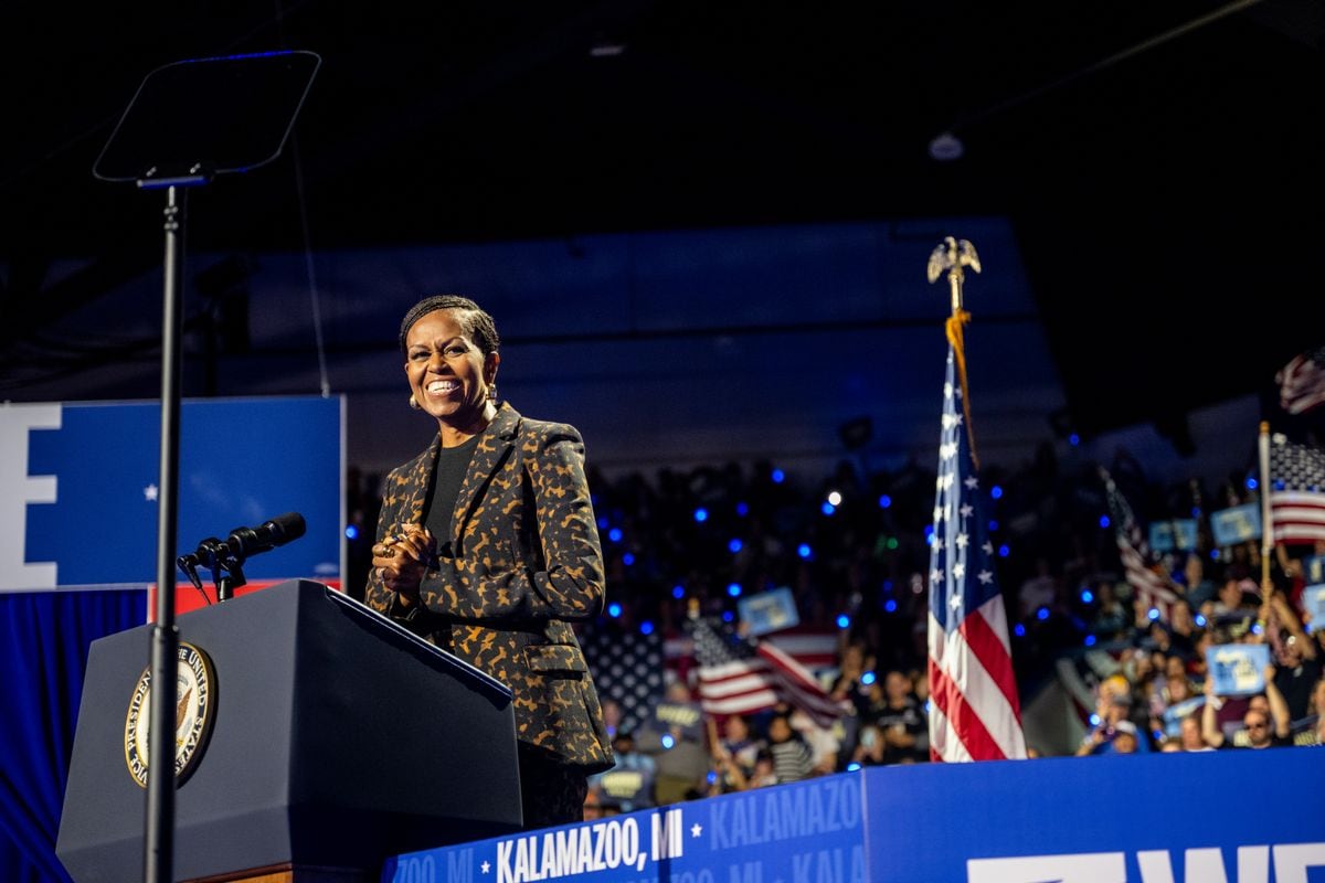 Michelle Obama smiles upon arrival to a campaign rally for Democratic presidential nominee, U.S. Vice President Kamala Harris