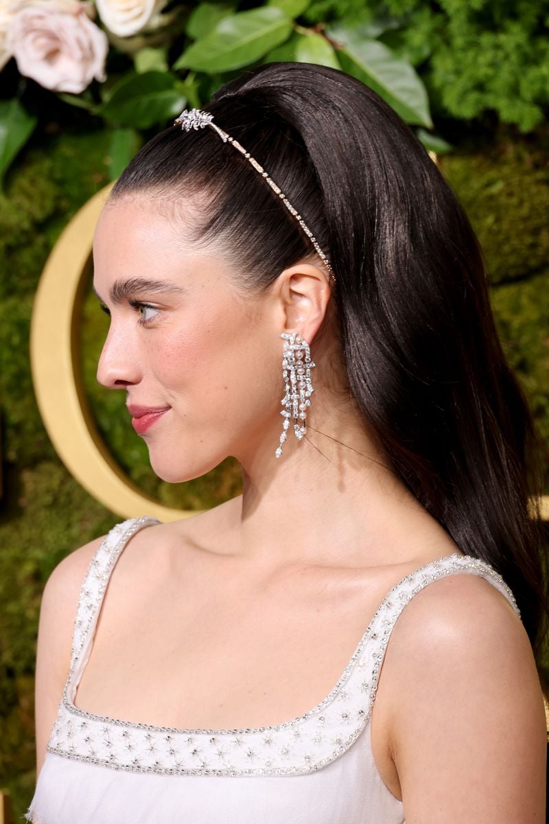 BEVERLY HILLS, CALIFORNIA - JANUARY 05: Margaret Qualley, fashion, headband, hair, and earring detail, attends the 82nd Annual Golden Globe Awards at The Beverly Hilton on January 05, 2025 in Beverly Hills, California. (Photo by Amy Sussman/Getty Images)