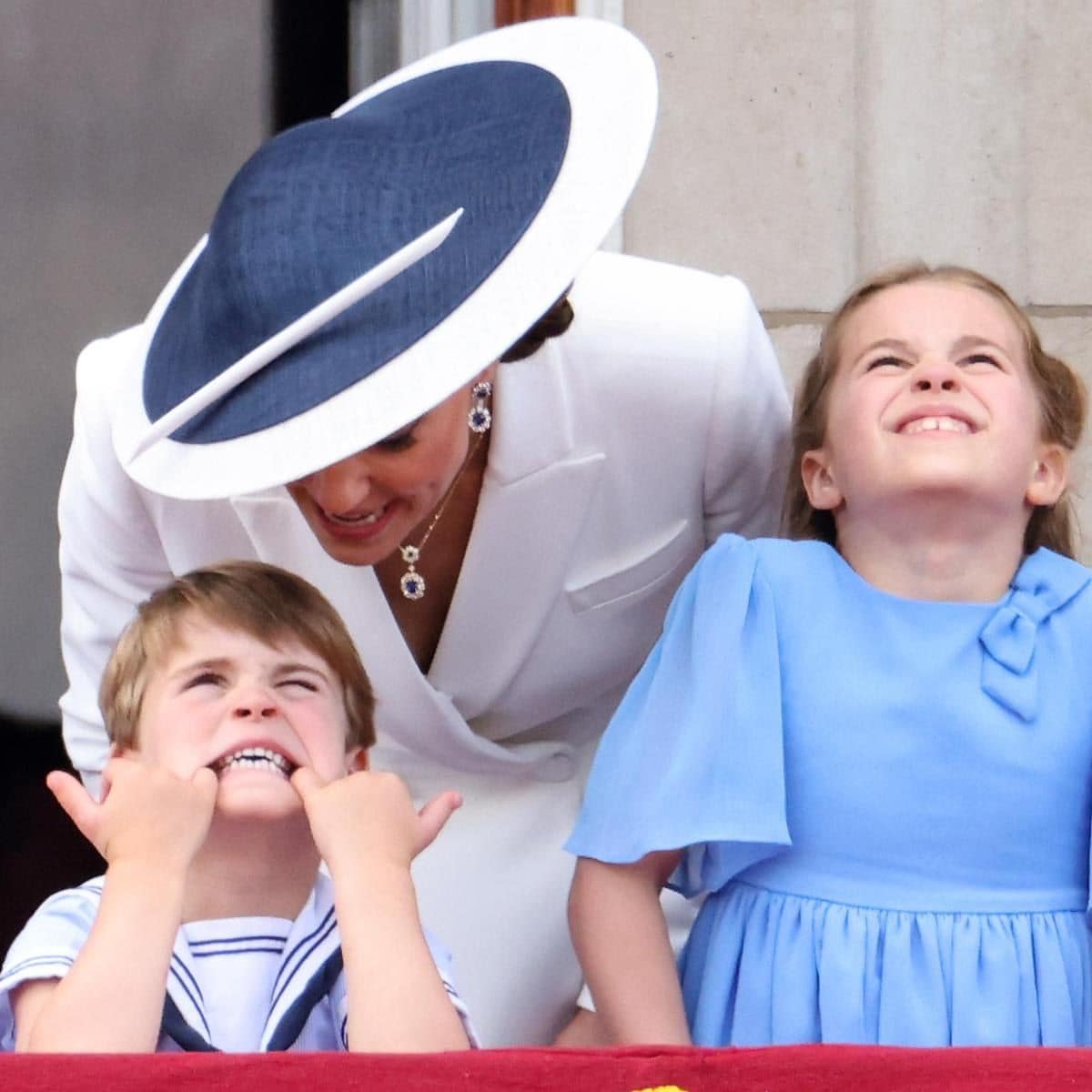 Louis looked up watching the flypast with his pinkies in his mouth.