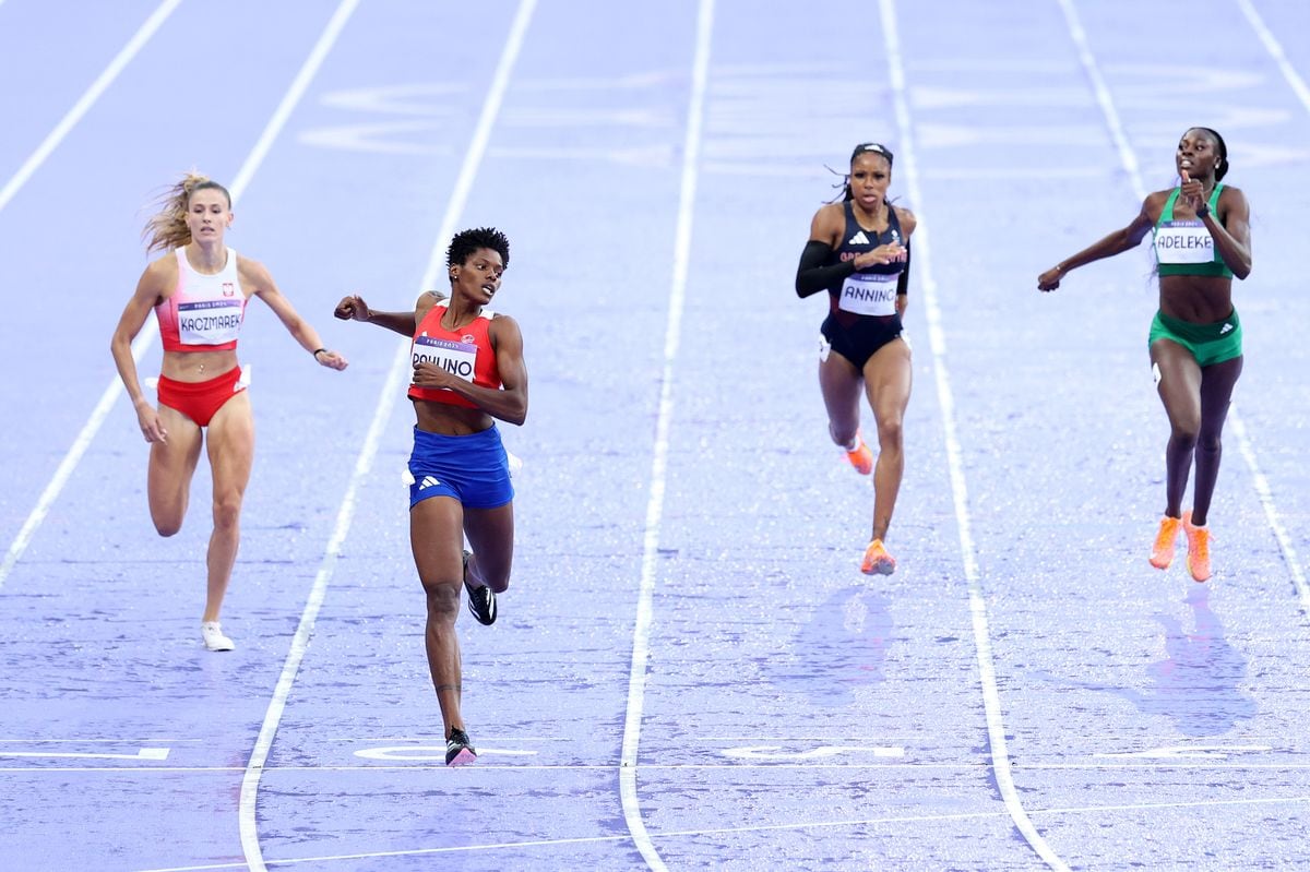 PARIS, FRANCE - AUGUST 09: Marileidy Paulino of Team Dominican Republic crosses the finish line to win after competing in the Women's 400m Final on day fourteen of the Olympic Games Paris 2024 at Stade de France on August 09, 2024 in Paris, France. (Photo by Patrick Smith/Getty Images)