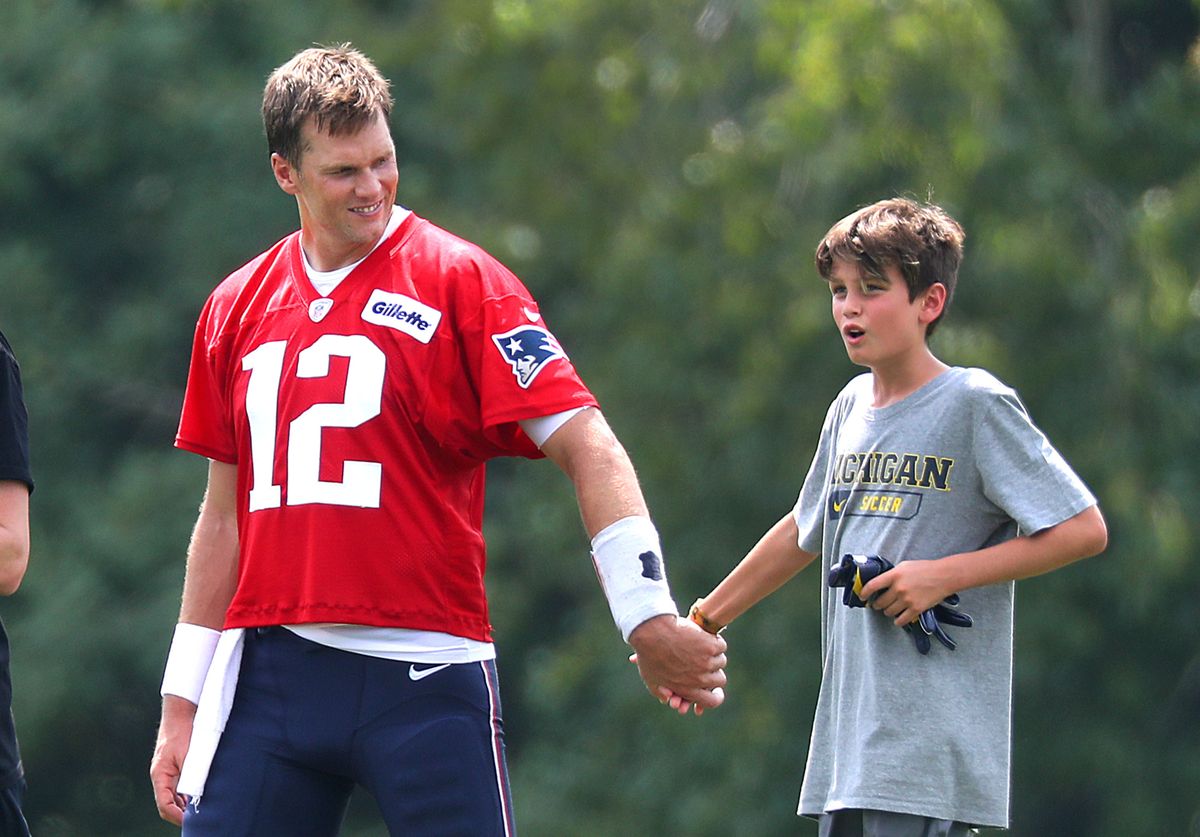 FOXBOROUGH, MA - AUGUST 7: New England Patriots quarterback Tom Brady walks off the field with his oldest son, Jack, 10, after New England Patriots training camp at the Gillette Stadium practice facility in Foxborough, MA on Aug. 7, 2018. (Photo by John Tlumacki/The Boston Globe via Getty Images)