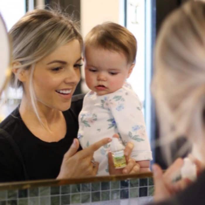 New mom Ali Fedotowsky shared some beauty secrets with her daughter Molly, including her way to defeat tired looking eyes! Ali took to Instagram to share the adorable moment (and tip), writing:
"These are the faces of a momma and baby that got little to no sleep the past few nights. The time change traveling back and forth to the east coast did not help us in the sleep department. Have you guys tried Witch Hazel to get rid of under eye puffiness (both from air travel and no sleep)? My grandma swore by it and now so do I. This @DickinsonsWitchHazel de-puffing eye gel, inner eye highlighter (opens the eye) and coffee are what's getting me through this week. Go snag yours at CVS."
Photo: Instagram/@alifedotowsky