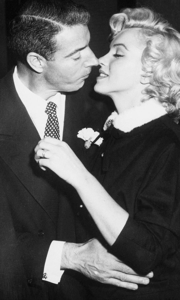 Joe DiMaggio and Marilyn Monroe Kiss