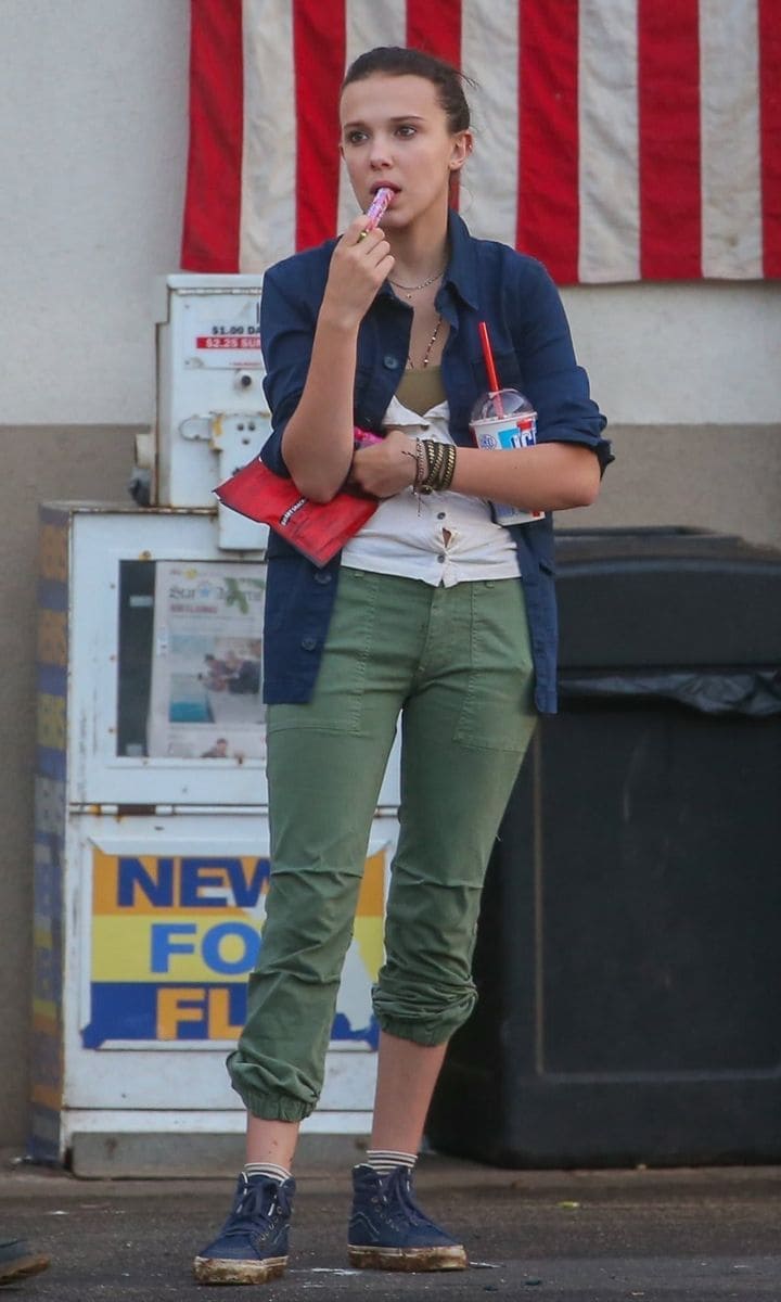 Millie Bobby Brown enjoying a slurpee on set