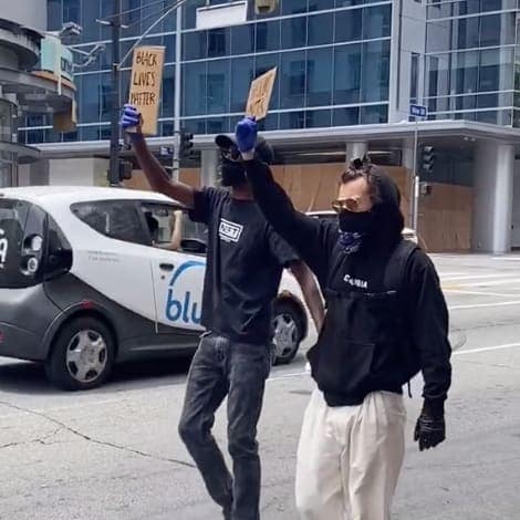 Harry Styles marching in the protest