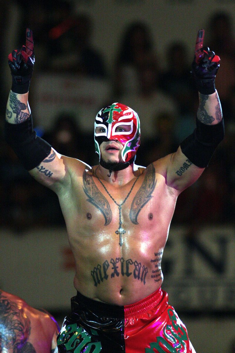 Wrestling fighter Rey Misterio raises his arms at the ring during  the WWE Smackdown wrestling function at Plaza Monumental Monterrey on October 15, 2009 in Monterrey, Mexico. 