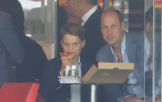 Prince George pictured eating pizza at a cricket match with his father in 2023