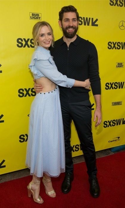 John Krasinski and Emily Blunt stepped out for a special red carpet together. The loved-up pair made an appearance at the 2018 SXSW Film Festival to premiere their upcoming thriller <i>A Quiet Place</i>, which co-stars the couple and was directed by John. Slated for an April 6 release, the film features John and Emily in their first non-animated flick together.
For the outing, Emily rocked a light Prabal Gurung dress, Christian Louboutin shoes, a Michael Kors clutch, and Azlee jewelry. Her hubby John opted for a darker look with a Ben Sherman sweater, Vince pants, and Rag & Bone shoes.
Photo: SUZANNE CORDEIRO/AFP/Getty Images