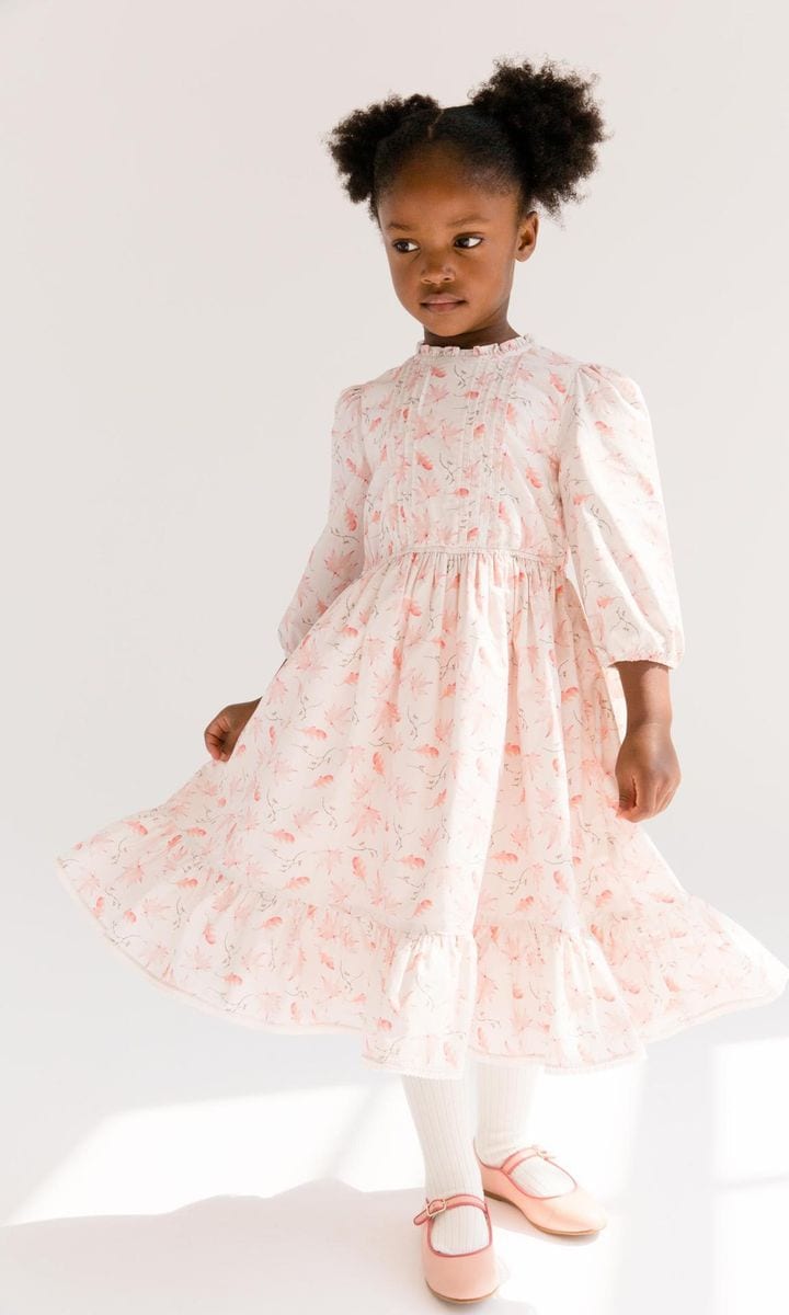 A pure cotton dress featuring an Oak leaf print and small pleats on the yoke and 3/4 length sleeves.