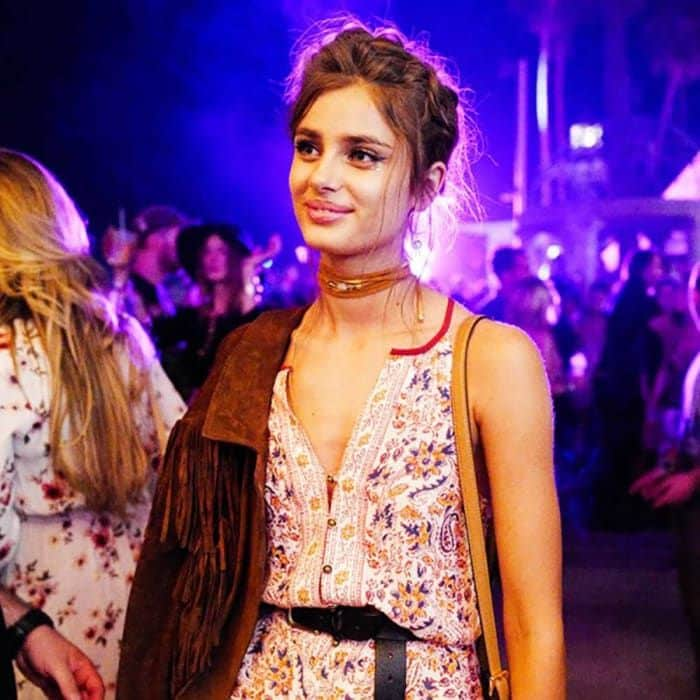 Victoria's Secret model Taylor Hill stunned in a Saylor Noelle Romper while taking in the music.
<br>
Photo: WWD/Rex/Shutterstock