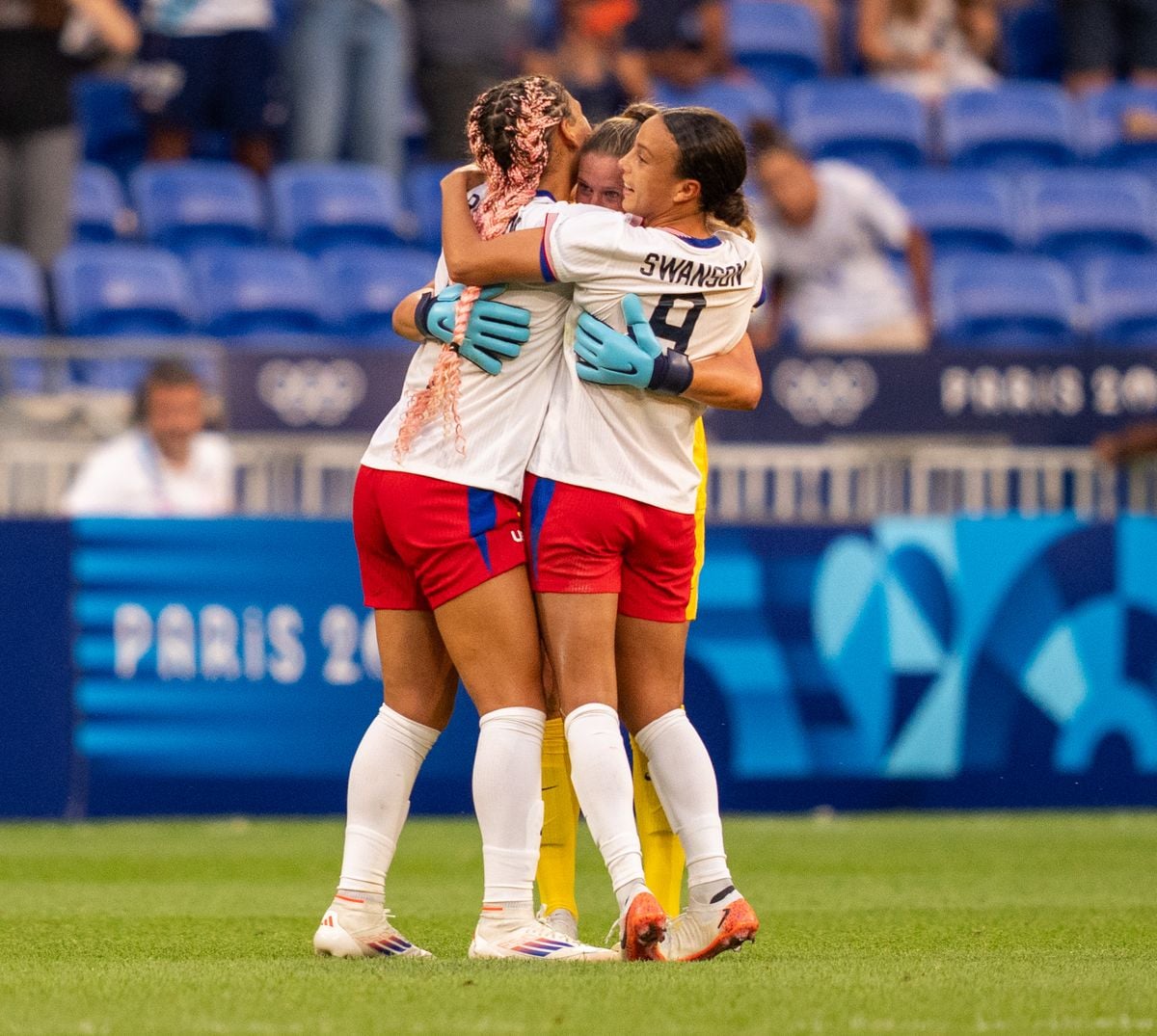 Trinity Rodman #5 of the United States celebrates with Alyssa Naeher #1 and Mallory Swanson #9 after the Women's Semifinal match between Germany and the United States 