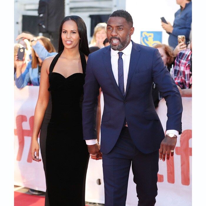 Idris Elba wasn't alone when he walked the red carpet at the premiere of <i>Molly's Game and The Mountain Between Us</i>. The handsome Hollywood star walked hand-in-hand with his gorgeous model girlfriend Sabrina Dhowre.
The former Miss Vancouver winner stunned the crowd in a sleek and sophisticated black floor-length gown, while her partner donned a simple navy blue suit. The two were all smiles as they posed for photos and greeted fans on the carpet.
The 29-year-old Somalia-born beauty has reportedly been dating Idris for the past six months. Though the 45-year-old typically keep his relationships hush-hush, Sabrina has been posting photos of the star all over her Snapchat.
Photo: Getty Images