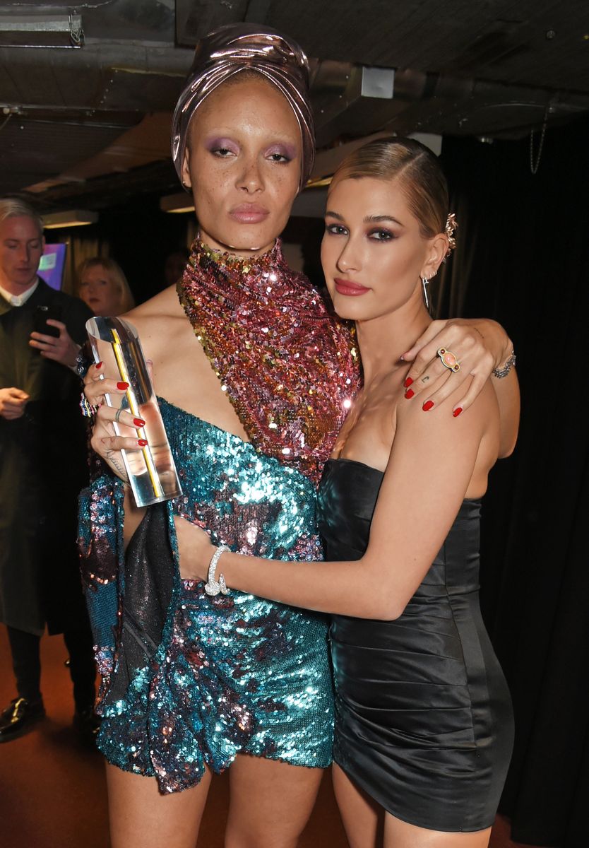 Model of the Year winner Adwoa Aboah (L) and Hailey Baldwin pose backstage at The Fashion Awards 2017 in partnership with Swarovski at Royal Albert Hall on December 4, 2017 in London, England.  (Photo by David M. Benett/Dave Benett/Getty Images)