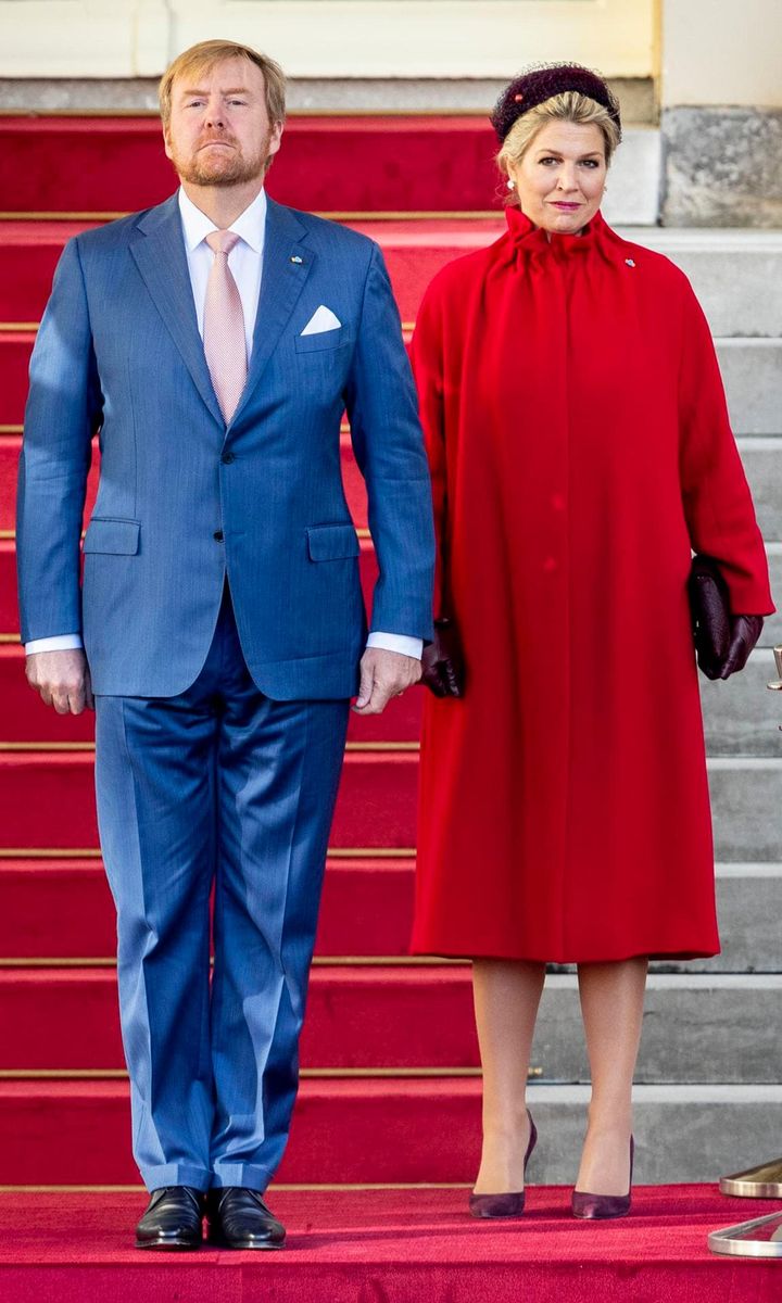 Queen Maxima wore a vibrant red coat on Oct. 29