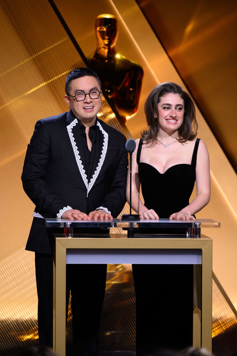 BEVERLY HILLS, CALIFORNIA - JANUARY 23: In this handout photo provided by The Academy, (L-R) Bowen Yang and Rachel Sennott speak onstage during the 97th Oscars Nominations Announcement at Samuel Goldwyn Theater on January 23, 2025 in Beverly Hills, California. FOR EDITORIAL USE ONLY (Photo by Richard Harbaugh/The Academy via Getty Images)