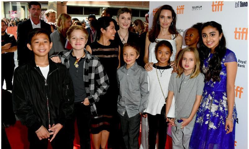 Angelina Jolie posing with four of her kids in Toronto