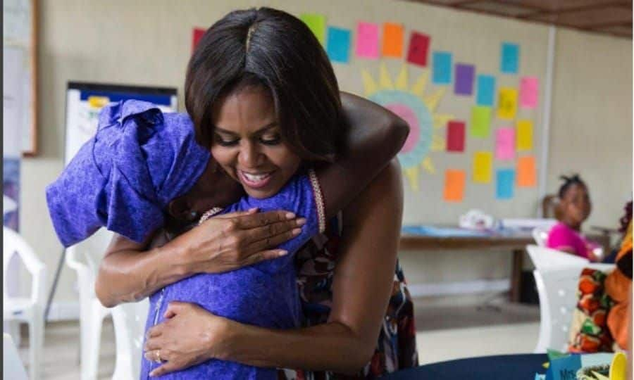 <b>Day One</b>
<br>
FLOTUS hugged a young student during her talk at Unification Town in Liberia. During the session, Michelle told the girls "You don't have to be somebody different to be important. You're important in your own right. Nobody wants you to act like a boy. People want and need to value you because of who you are, because of your story, because of your challenges. That's what makes you unique."
<br>
Photo: Instagram/@michelleobama