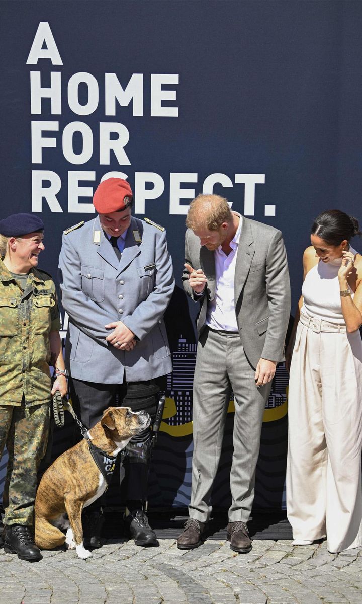 Prince Harry met Steffi Schenke and her service dog, who according to the Invictus Games Foundation, is named "Loki."