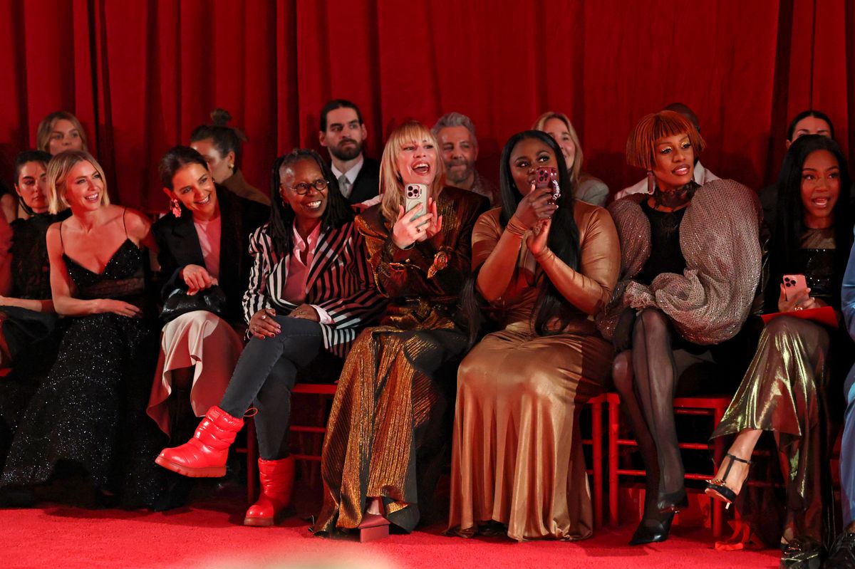 (L-R) Paige DeSorbo, Julianne Hough, Katie Holmes, Whoopi Goldberg, Natasha Bedingfield, Danielle Brooks, Laverne Cox, and Tiffany Haddish attend the Christian Siriano Fall/Winter 2025 runway show at Chelsea Industrial in New York City.