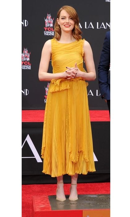 <i>La La Land</i> actress Emma Stone kept on trend wearing a Rochas dress paired with Jimmy Choo shoes at her hand and footprint ceremony held at the TCL Chinese Theatre IMAX in Hollywood, California.
Photo: Gregg DeGuire/WireImage