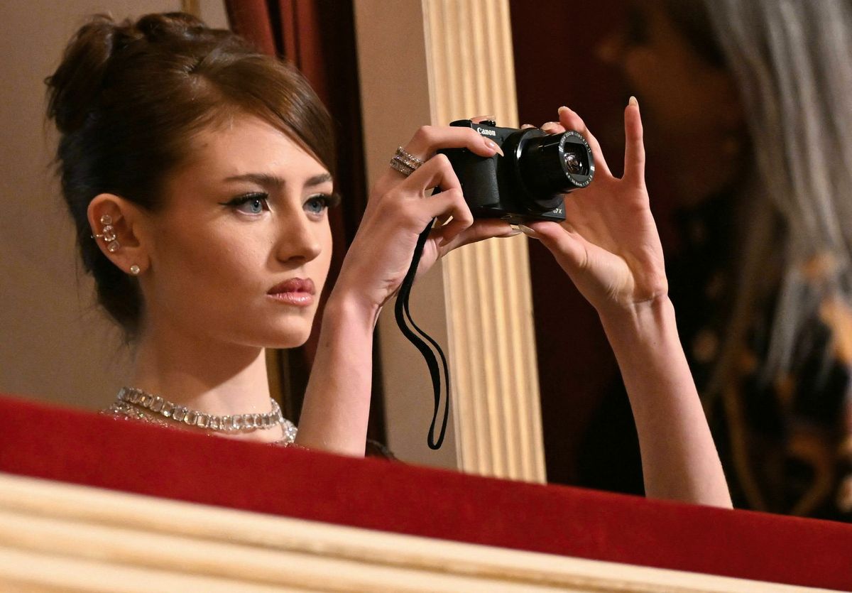 Leni Klum uses a camera as she attends the 67th edition of the Vienna Opera Ball at The State Opera in Vienna.