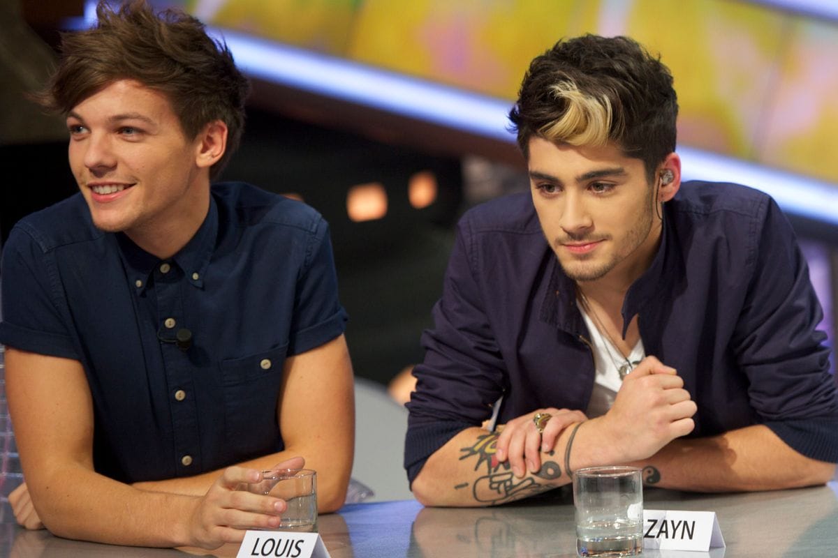 MADRID, SPAIN - OCTOBER 31:  (L-R)Louis Tomlinson and Zayn Malik of One Direction attend "El Hormiguero" Tv show at Vertice Studio on October 31, 2012 in Madrid, Spain.  (Photo by Juan Naharro Gimenez/Getty Images)