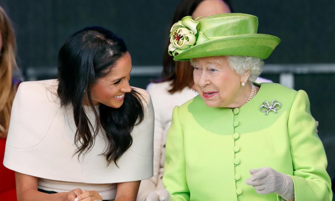 Queen Elizabeth dressed in green with Meghan Markle