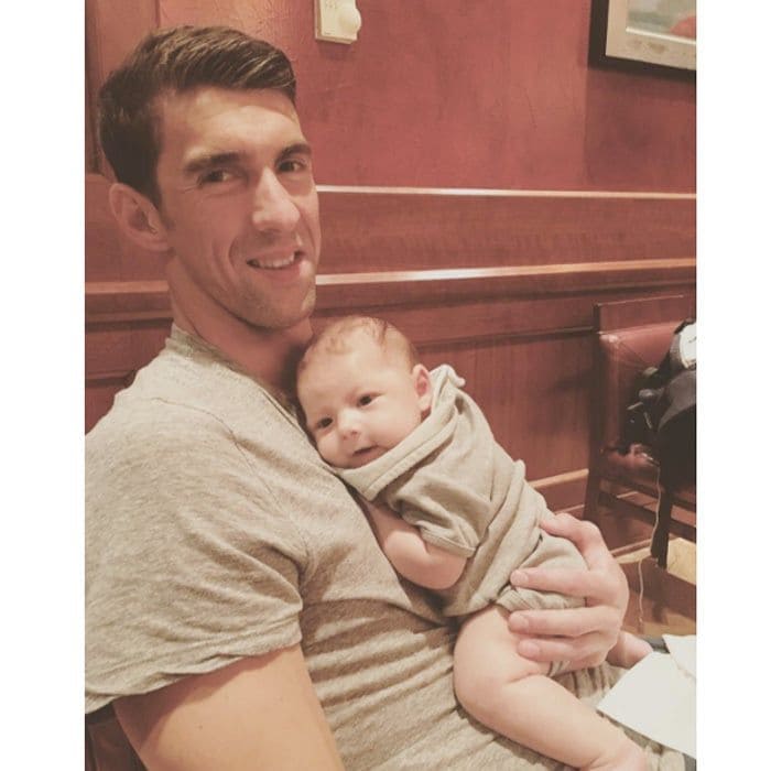 Michael Phelps' little boy was a happy camper in his dad's arms.
<br>
Photo: Instagram/@nicole.m.johnson